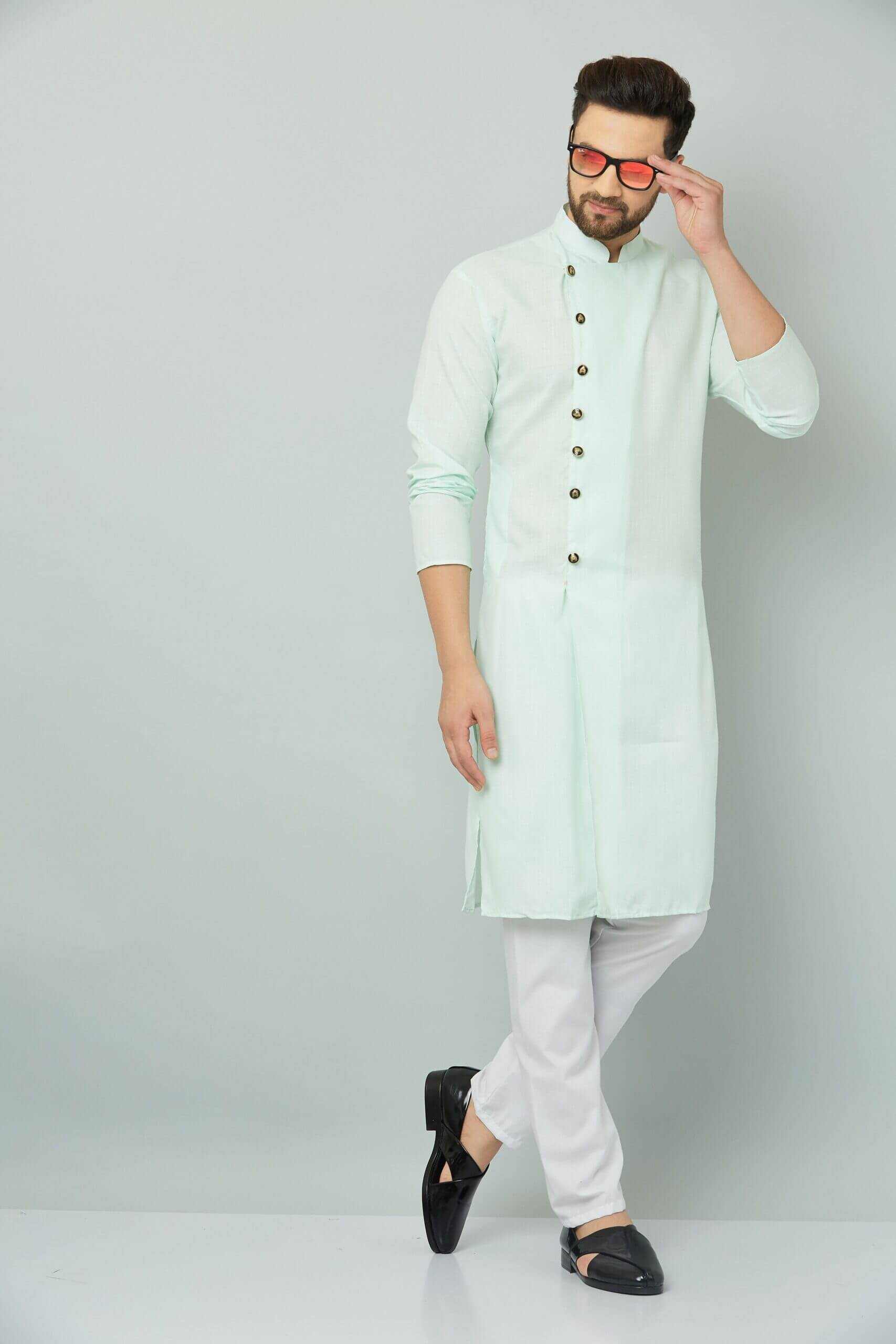 p (1)-min Image of a man in a mint green kurta and white pants, representing Teradozz brand's Indian style