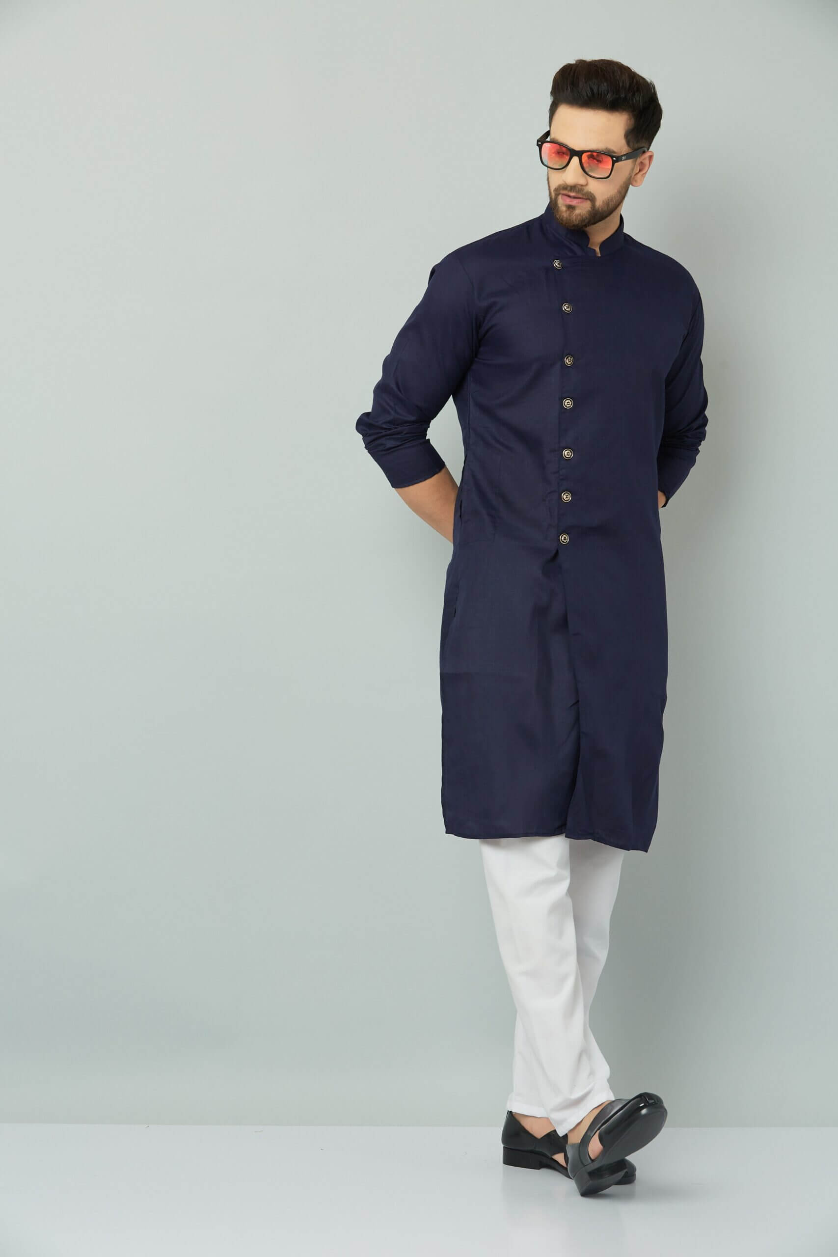p (3)-min Man in navy blue Indian kurta.