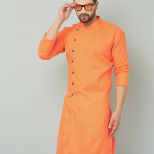 Orange cotton kurta with white pants, traditional Indian attire.