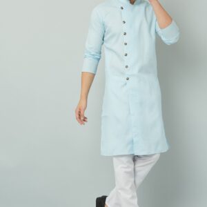 Traditional Indian men's blue kurta paired with white pants and black shoes.